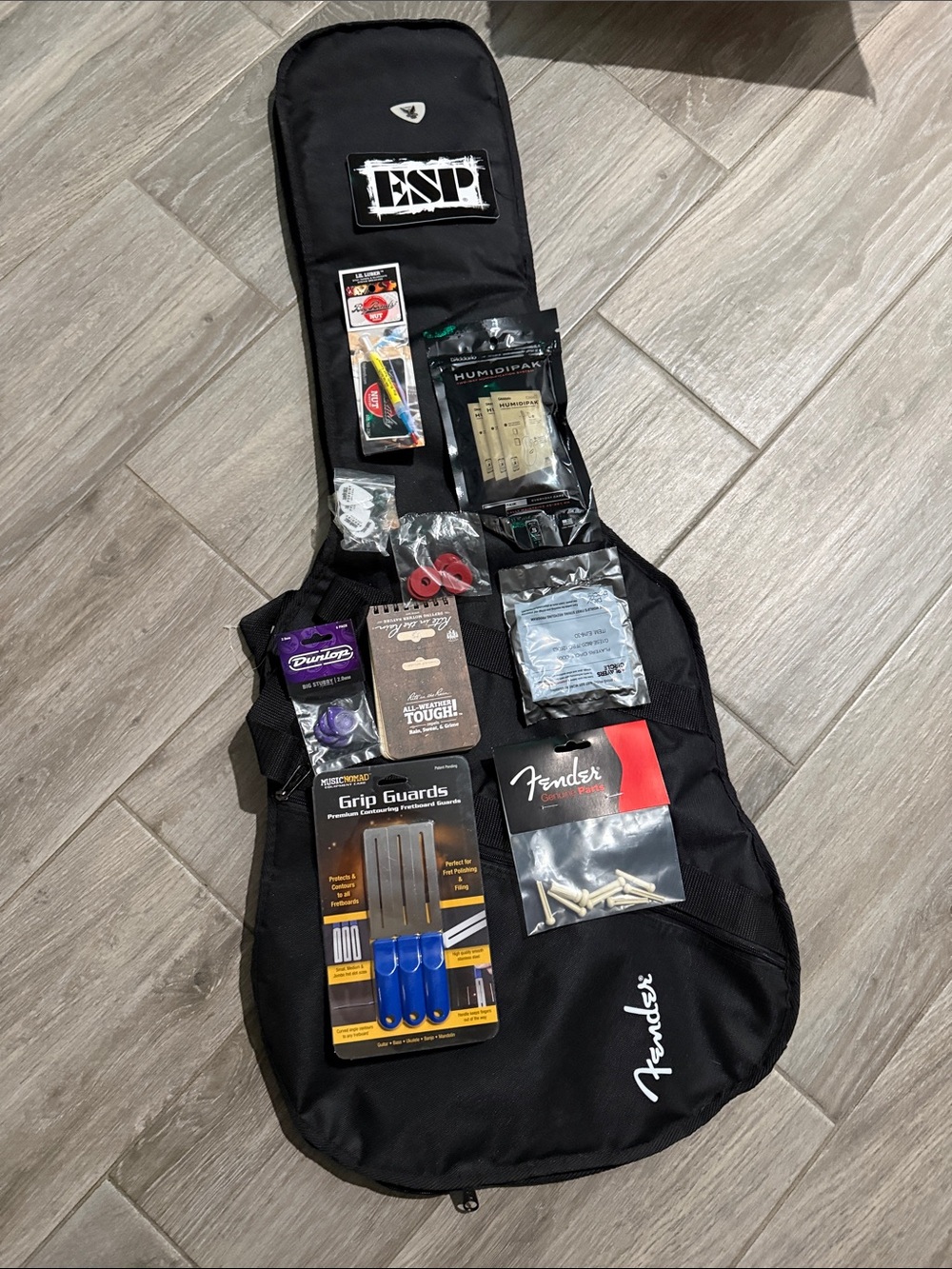 Fender Black Guitar Gig Bag with Assorted Guitar Accessories